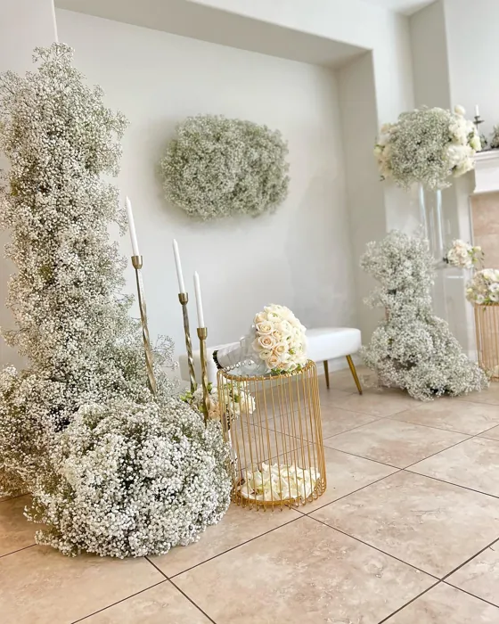 Sculptural baby's breath floral installation with gold stands